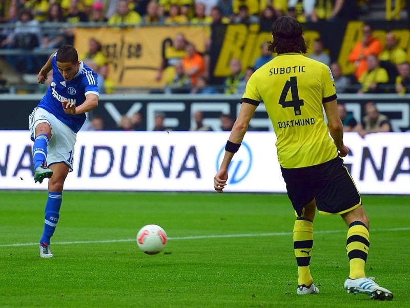 DORTMUND, GERMANY - OCTOBER 20: Ibrahim Affelay of Schalke scores his teams first goal during the Bundesliga match between Borussia Dortmund and FC Schalke 04 at Signal Iduna Park on October 20, 2012 in Dortmund, Germany.  (Photo by Lars Baron/Bongarts/Getty Images)