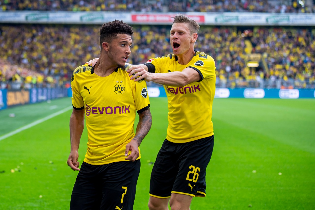 Bei Borussia Dortmund wurden sie Freunde: Jadon Sancho (l.). und Lukasz Piszczek.