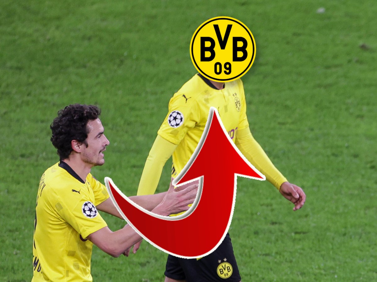 Borussia Dortmunds Jude Bellingham und Thomas Delaney laufen nebeneinander über den Platz.